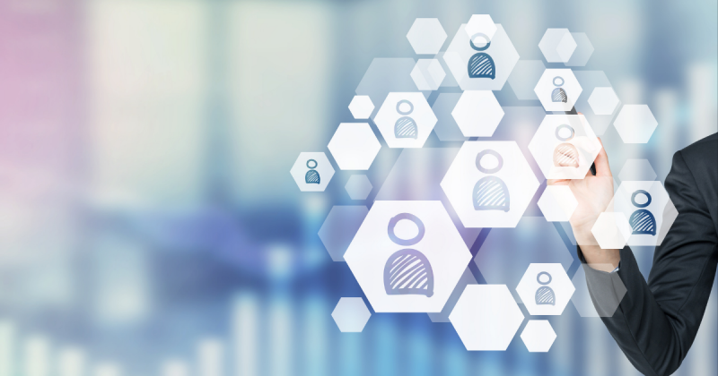 Multicolored background overlayed with white hexagons featuring standard avatars.